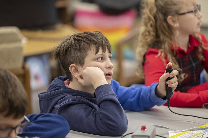 John Siebert, 3rd grade, sits poised with the Scholastic Bowl buzzer Thursday, Feb. 1, 2024 at St. Mary’s School in Dixon.