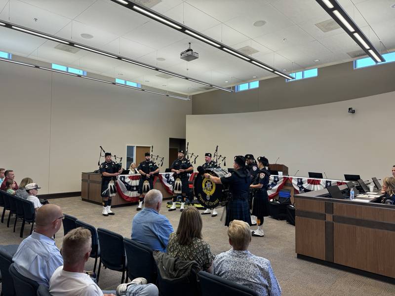 The Joliet Pipe and Drums play during the police and firefighter memorial ceremony at Morris City Hall on Thursday.