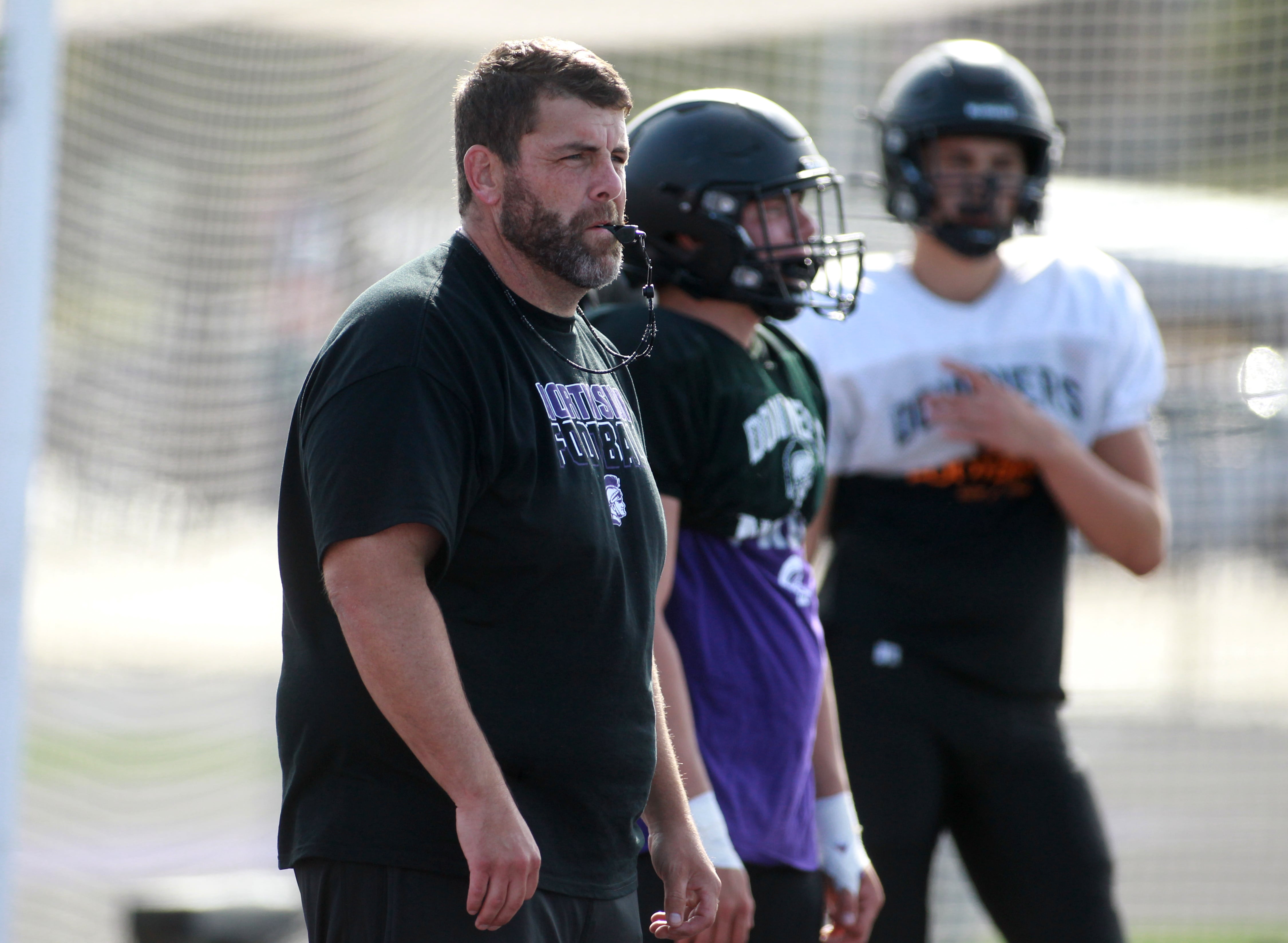 Downers Grove North Head Coach Joe Horeni leads a practice on Tuesday, Aug. 20, 2024 at the school.