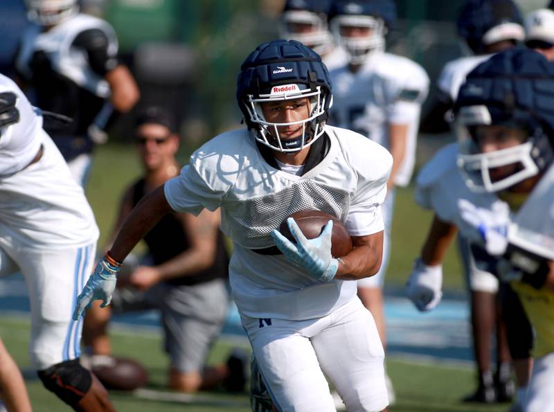 Nazareth wide receiver James Penley carries the ball during a practice on Monday, Aug. 19, 2024 at the La Grange Park School.