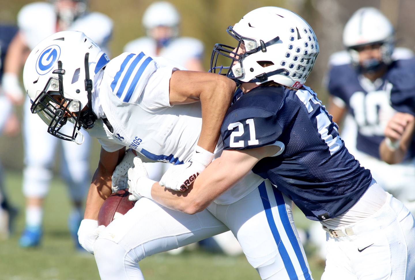 Cary-Grove’s Patrick Weaver, right, chases down Geneva’s Talyn Taylor in IHSA Class 6A quarterfinal playoff football action at Cary Saturday.