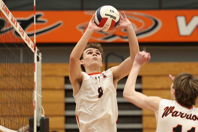 Lincoln-Way West’s Noah Konopack sets the ball against Plainfield North on Monday, March 18, 2024 in New Lenox.