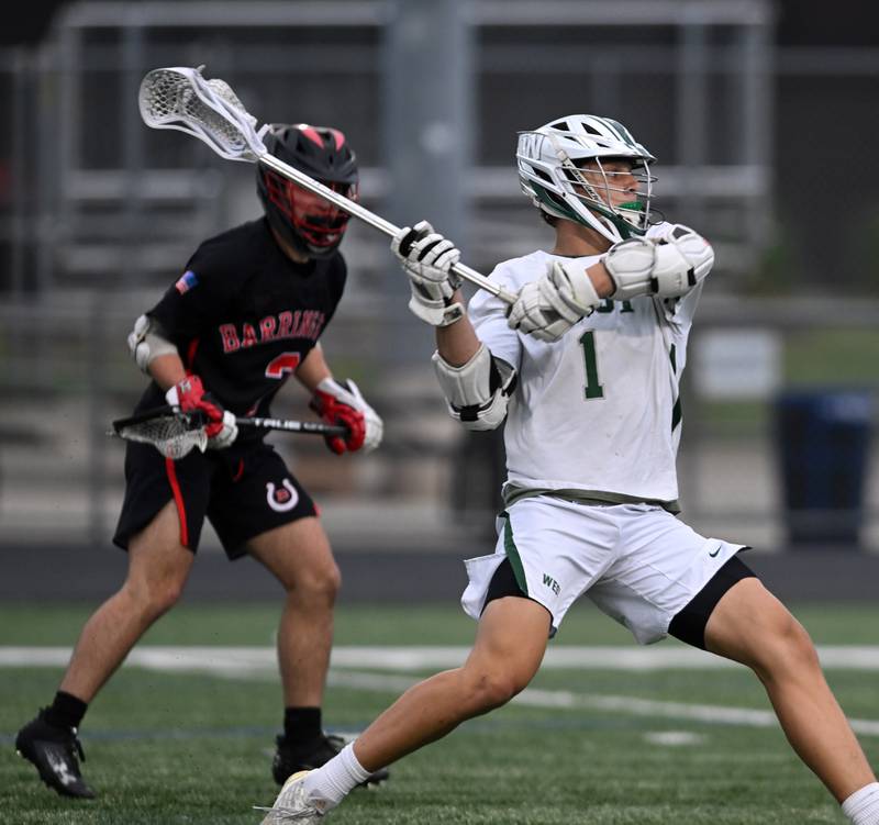 Glenbard West’s Ben Cesario shoots and scorres during the Barrington boys lacrosse sectional championship on Friday, May 24, 2024 in Barrington.