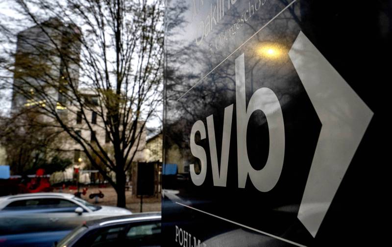 A sign of a branch of the Silicon Valley Bank is pictured at an office building where the bank is located in Frankfurt, Germany, Monday, March 13, 2023. (AP Photo/Michael Probst)