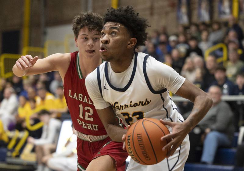 Sterling’s Kaedon Phillips drives the baseline against LaSalle-Peru Friday, Feb. 23, 2024 during a class 3A regional final at Sterling High School.