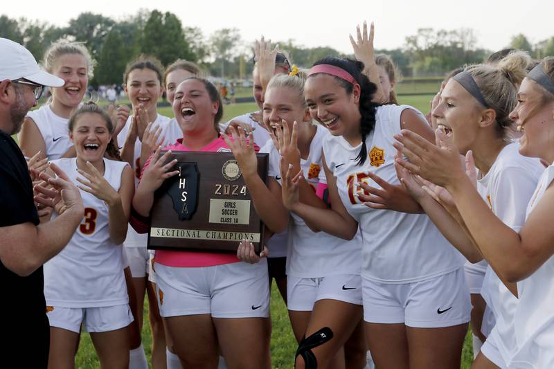 Richmond-Burton celebrates their 3-1 victory over Johnsburg in the IHSA Class 1A Marian Central Sectional championship match on Tuesday, May 21, 2024, at Marian Central High School.