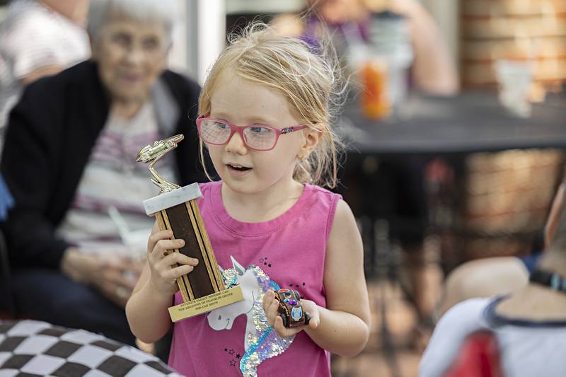 Olivia Ford, 5, of Franklin Grove excitedly takes home her “Favorite Family Member” trophy Friday, June 23, 2023 at Franklin Grove Assisted Living.