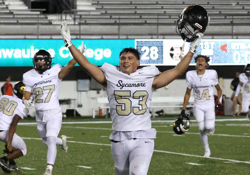 Sycamore players celebrate their win over DeKalb on a late touchdown Friday, Aug. 30, 2024, during the FNBO Challenge at Huskie Stadium at Northern Illinois University.