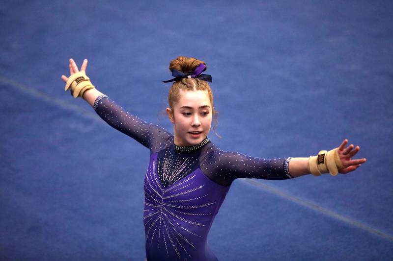 Downers Grove South’s Edith Condon competes on the floor exercise during the IHSA Girls State Gymnastics Meet at Palatine High School on Friday, Feb. 16, 2024.