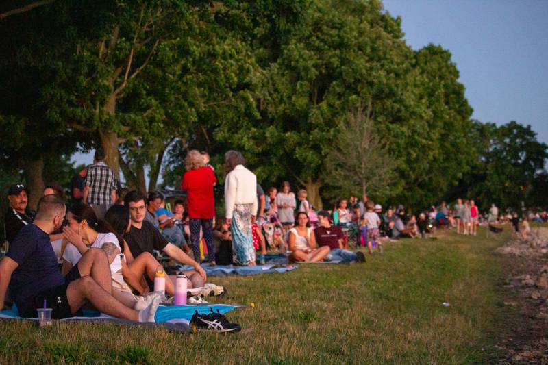 People of Mendota sit on Lake side in preparation of the fireworks display on Saturday, June 29, 2024 in Mendota.