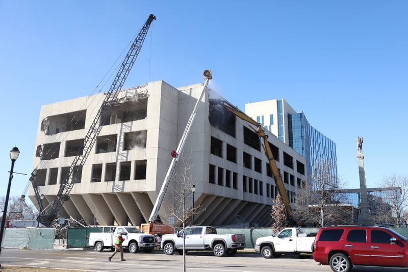 A wreaking ball and claw begin working on the external demolition of the old Will County Courthouse on Friday, Feb. 9th 2024 in Joliet.