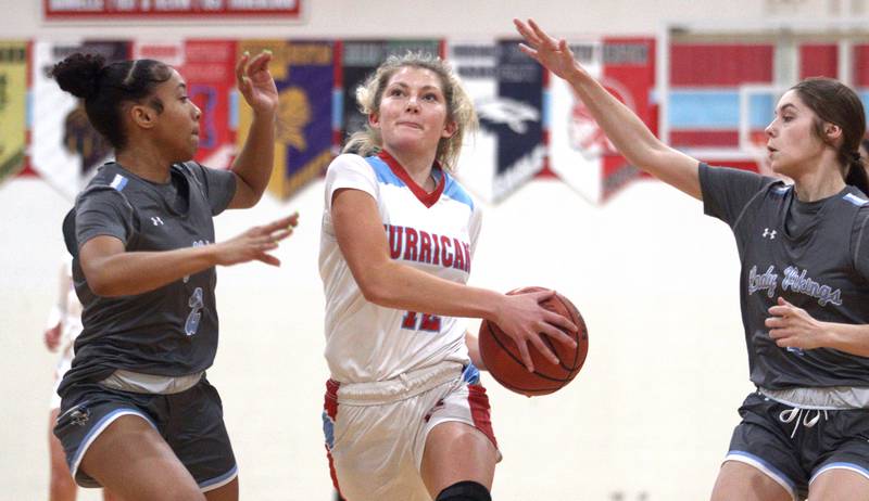 Marian Central’s Madison Kenyon finds her way to the hoop against Rockford Guilford in varsity girls basketball Saturday at Landers Pavilion on the campus of Marian Central High School in Woodstock.