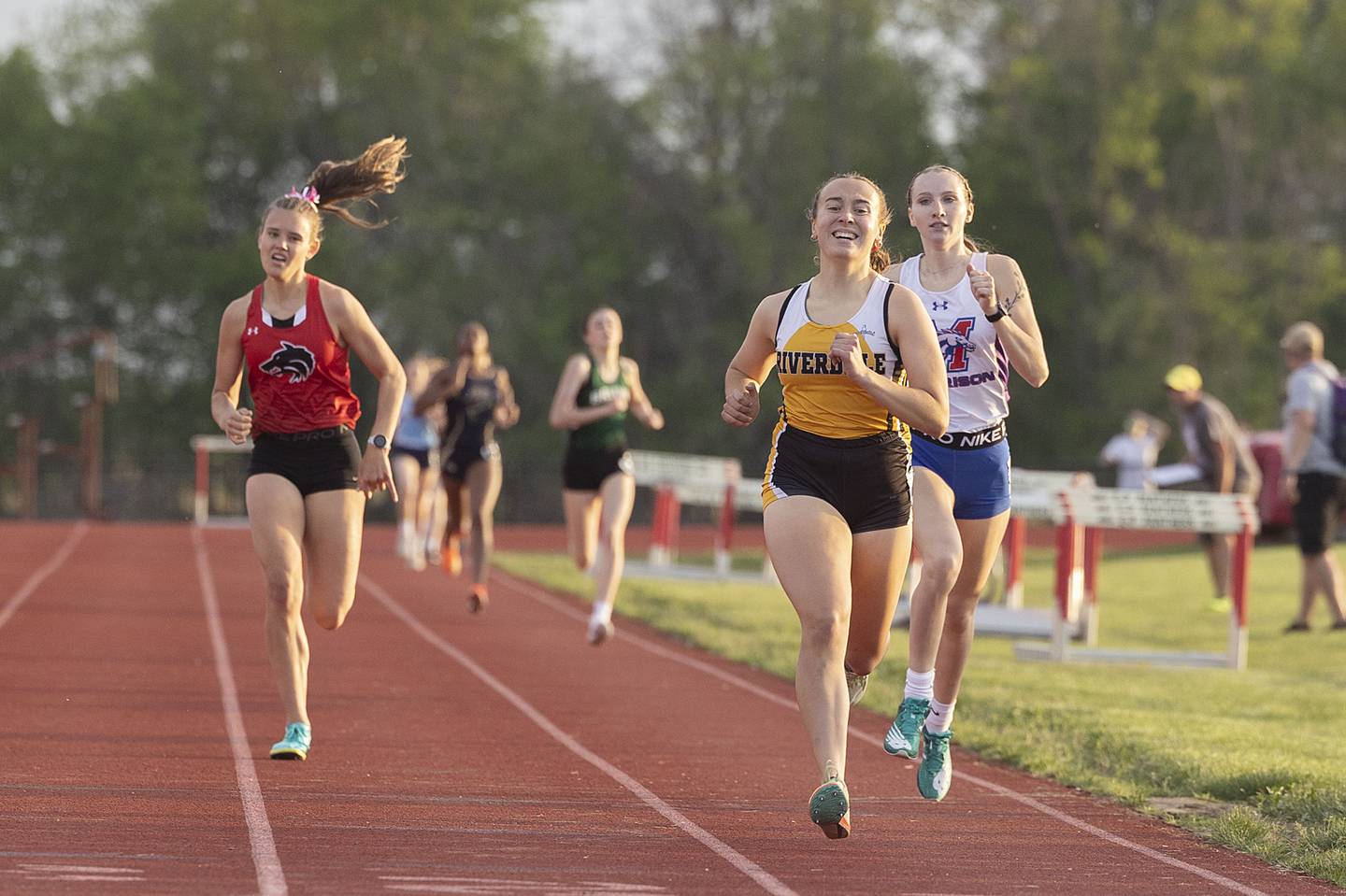 Riverdale’s Mattea Wuest wins the 800 run ahead of Indian Creek’s Caroline Bend (left) and Morrison’s Erika King Wednesday, May 10, 2023 at the class 1A Erie girls track sectional.