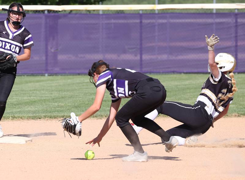 Sycamore's Keera Trautvetter slides into second as Dixon’s Kennedy Haenitsch tries to grab the ball during their Class 3A regional championship game Thursday, May 23, 2024, at Rochelle High School.