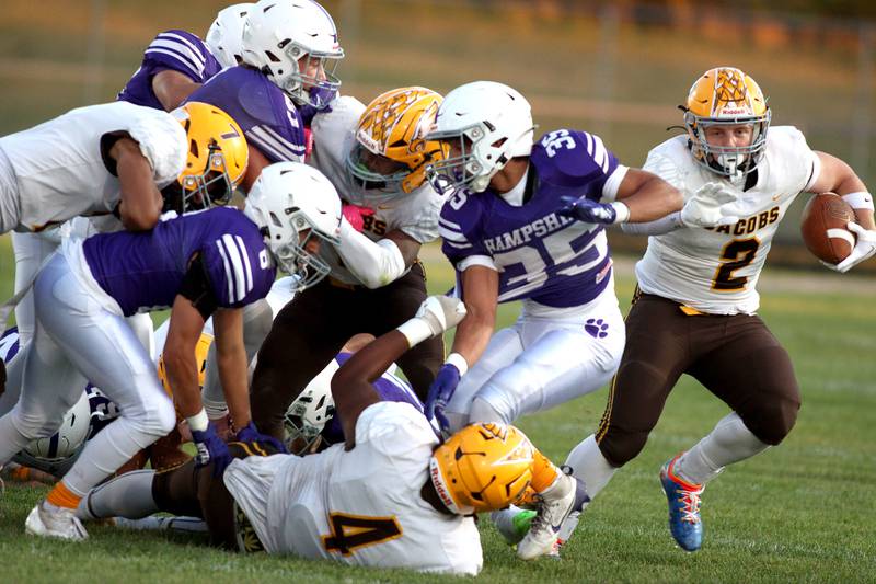 Jacobs’ Caden DuMelle, right, breaks from the pack for a long touchdown run in varsity football on Friday, Sept. 6, 2024, at Hampshire School in Hampshire.