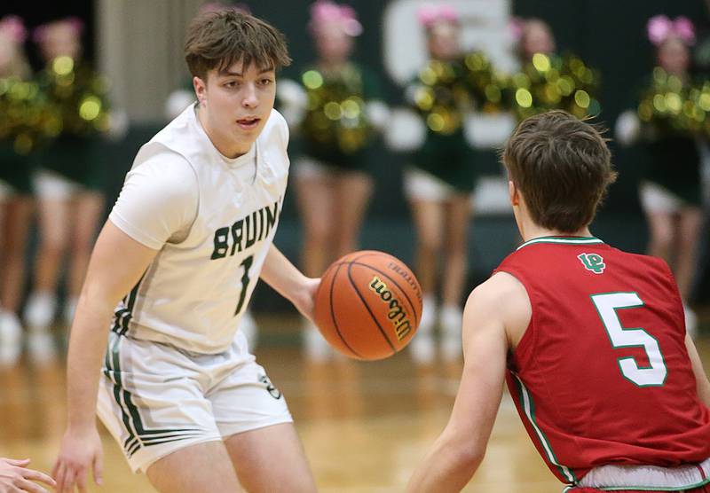 St. Bede's Halden Hueneburg looks to pass the ball away from L-P's Seth Adams on Wednesday, Feb. 14, 2024 at St. Bede Academy.