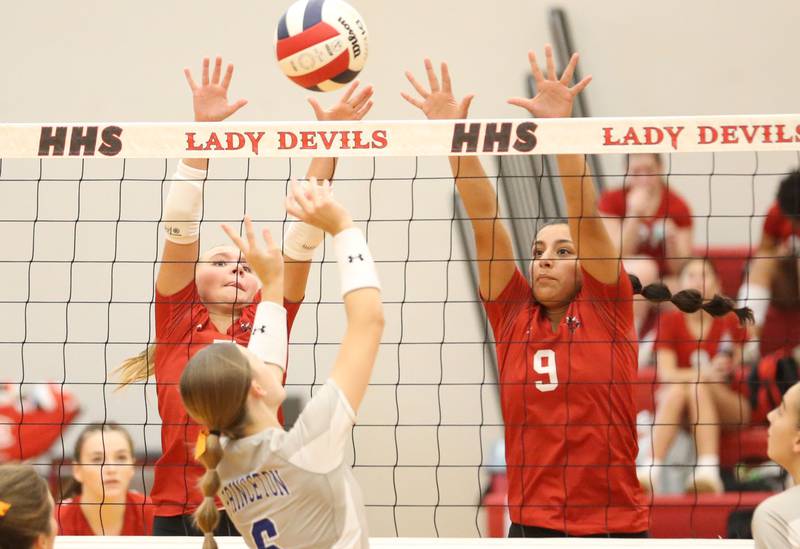 Hall's Charlie Pellegrini and teammate Natalia Zamora  block a spike from Princeton's Caroline Keutzer on Tuesday, Sept. 17, 2024 at Hall High School.