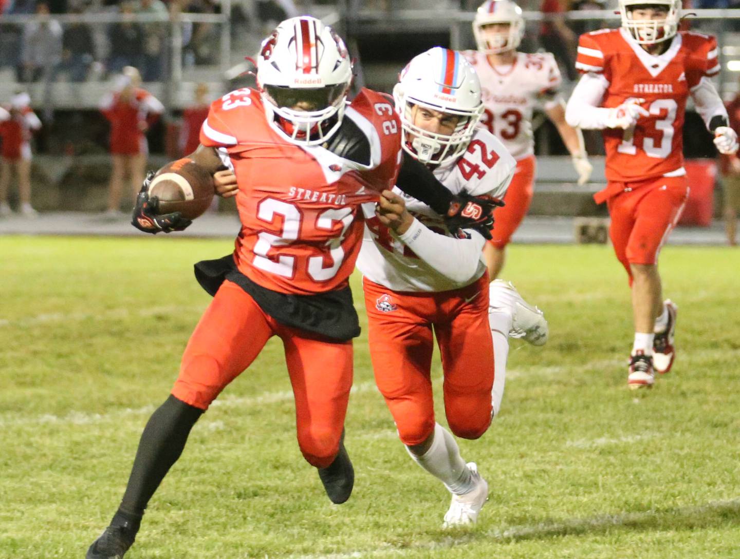 Streator's Jordan Lukes carries the ball as Ottawa's Joey Liebhart defends on Friday, Sept. 6, 2024 at Doug Dieken Stadium.