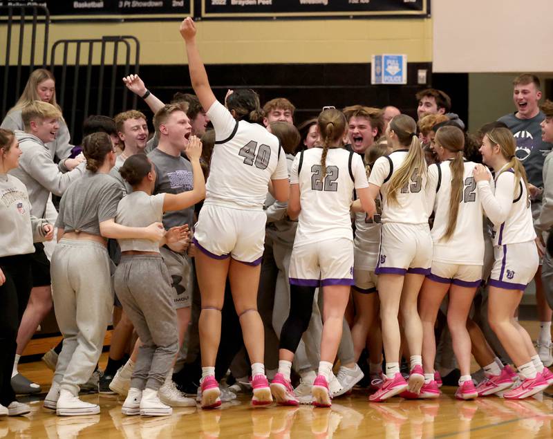 Dixon players and fans celebrate their Class 3A regional championship win over Kaneland Thursday, Feb. 22, 2024, at Sycamore High School.