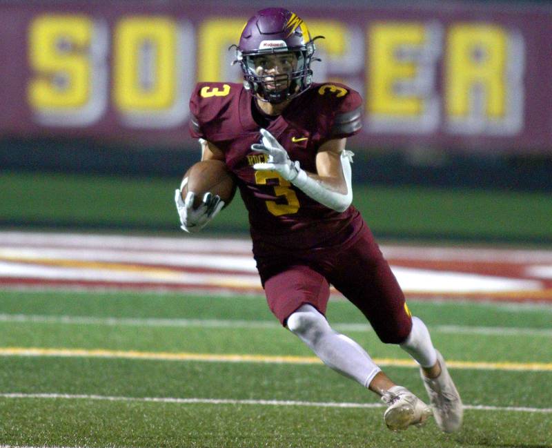 Richmond-Burton’s Oscar Bonilla Jr. runs the ball against  Johnsburg in varsity football action on Friday, Sept. 13, 2024, at Richmond-Burton High School in Richmond.