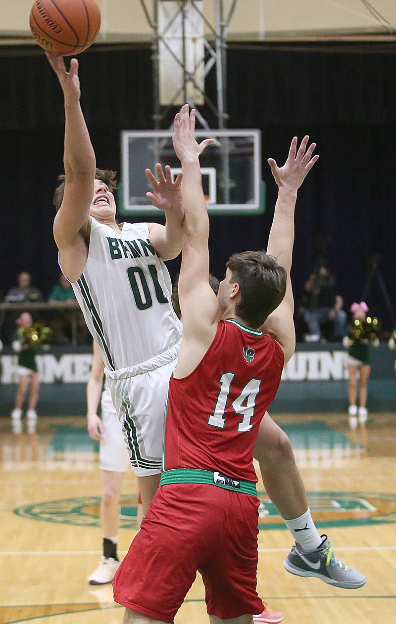 St. Bede's Nathan Husser eyes the hoop as L-P's Brendan Boudreau defends on Wednesday, Feb. 14, 2024 at St. Bede Academy.