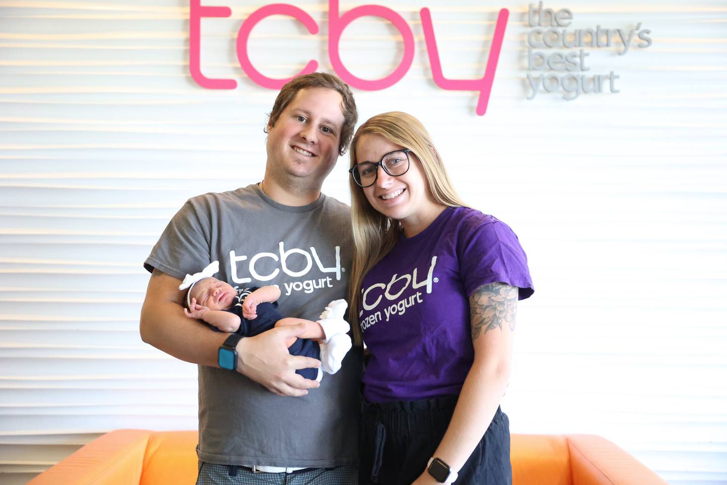 TCBY frozen yogurt new owner Jana Brodeur stands with her husband Trevor and newborn daughter Avery on Thursday June 6, 2024 in Shorewood.