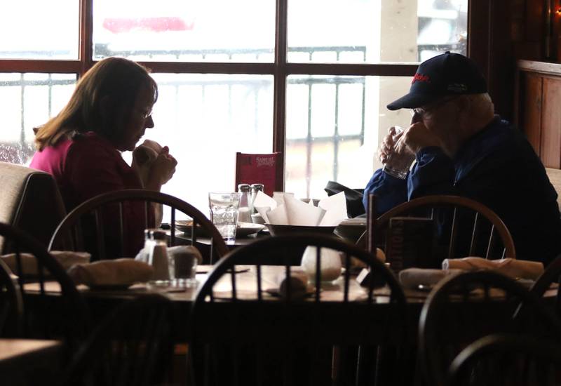 A couple has lunch inside the front window Wednesday, Feb. 22, 2023, at The Hillside Restaurant in DeKalb. Hillside will soon be closing its doors after 68 years in business.