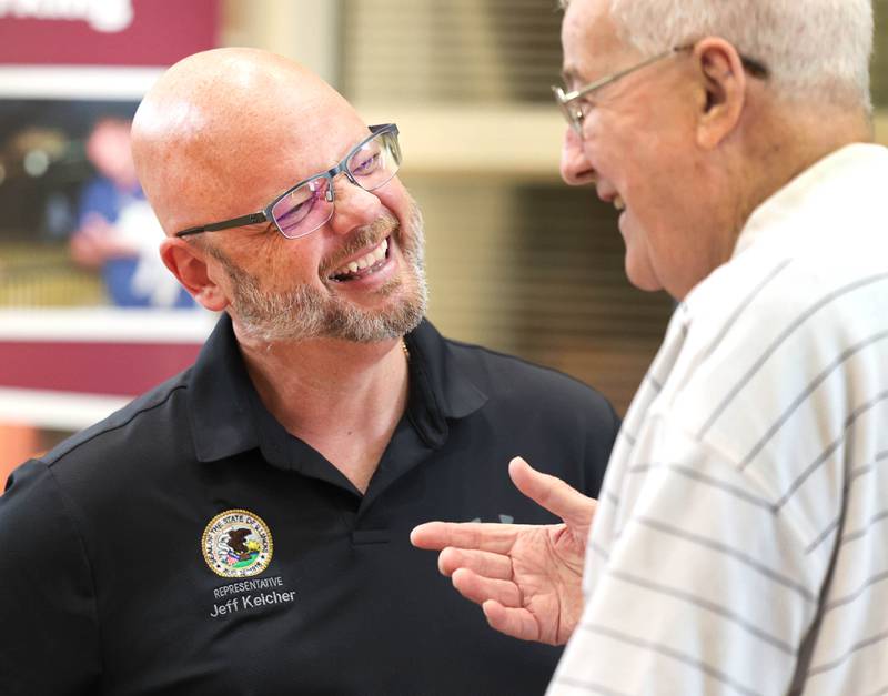 Illinois State Rep. Jeff Keicher, R-Sycamore, visits with an attendee during the senior health fair Wednesday, July 12, 2023, at DeKalb High School. Keicher was one of the sponsors of the event along with other state legislators.