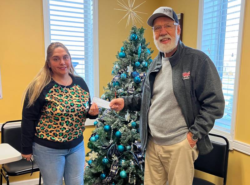 Lion Ken Johnson recently presented the Yorkville Lions Club’s annual donation to the Kendall County Community Food Pantry.