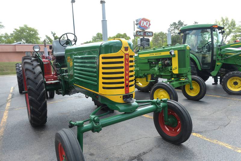 Three tractors that took part in the Living History Antique Equipment Association's tractor drive on Saturday sit in the parking lot at the Oregon Dairy Queen. About 40 tractors took part in the ride that started at the association's show grounds in Franklin Grove and traveled to Oregon and back. Drivers stopped at the DQ before heading back to Franklin Grove.