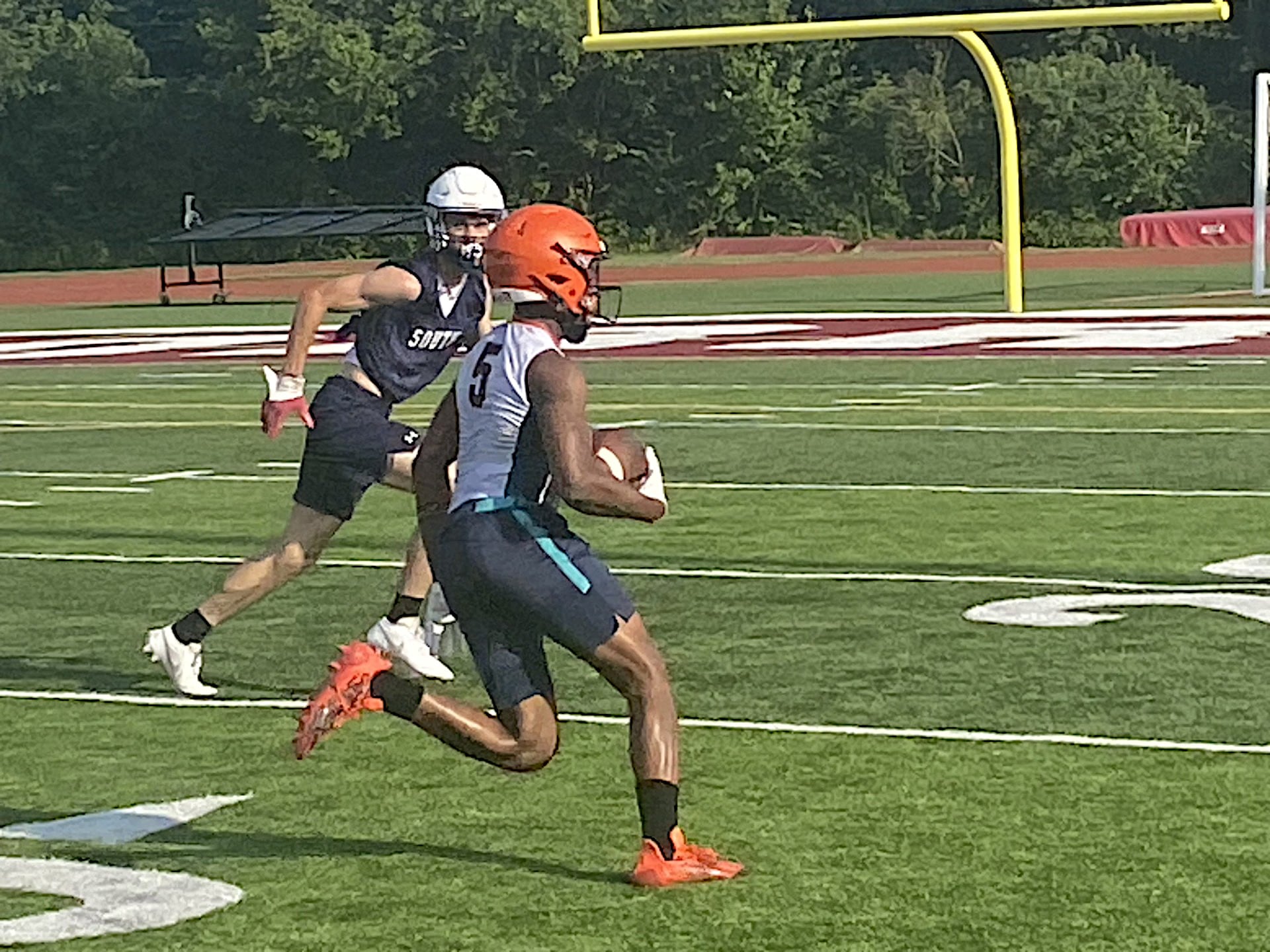 Romeoville's Caron Johnson heads upfield during a recent 7 on 7 competition at Morris.