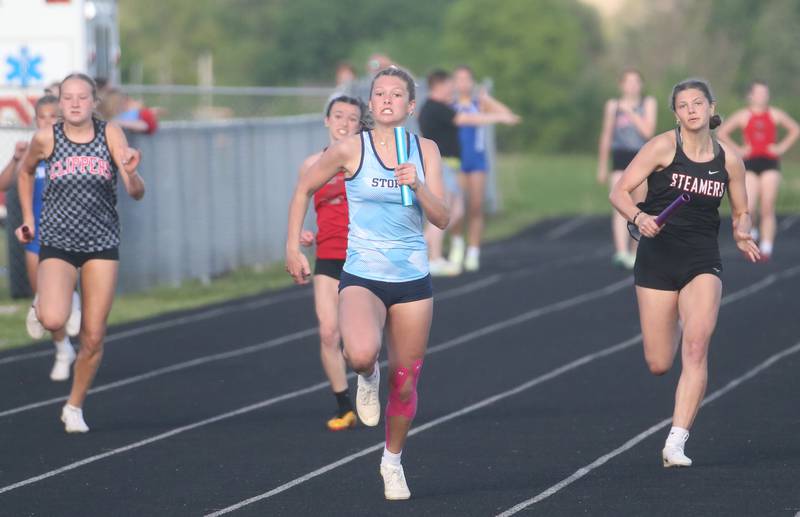 Bureau Valley's McKinley Canady pulls ahead of Amboy's Bella Yanos, Henry-Senachwine's Daniella Bumber and Fulton's Miraya Pressman to win the 4x100 meter relay during the Class 1A Sectional meet on Wednesday, May 8, 2024 at Bureau Valley High School.