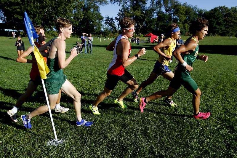 Runners compete in the boys race of the McHenry County Cross Country Invite on Saturday, August 31, 2024, at McHenry Township Park in Johnsburg.