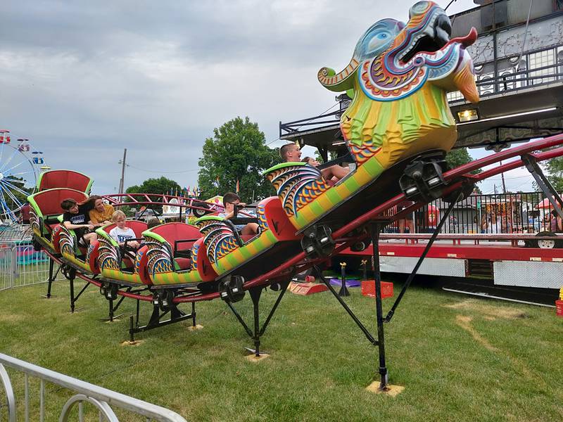 Children ride the dragon coaster Thursday, June 27, 2024, at the Sheffield Summer Festival in West Park.