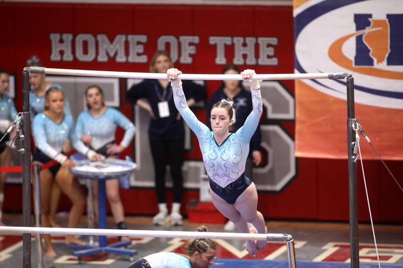 Lake Park’s Cali Keefe competes on the uneven parallel bars during the IHSA Girls State Gymnastics Meet at Palatine High School on Friday, Feb. 16, 2024.