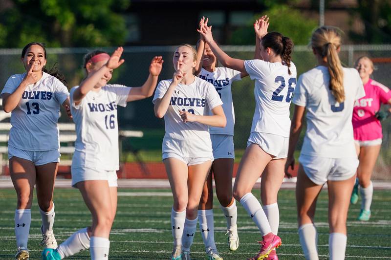 Oswego East players celebrate after defeating Oswego 2-0 in a a Class 3A Lockport Regional semifinal soccer match at Lockport High School in Lockport on Wednesday, May 15, 2024.