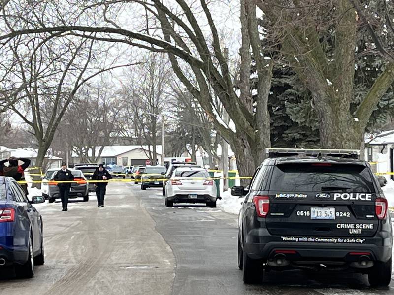 Police at the scene on the 2200 block of West Acres Road in Joliet where multiple people were found shot to death in homes on Monday, Jan. 23, 2024.