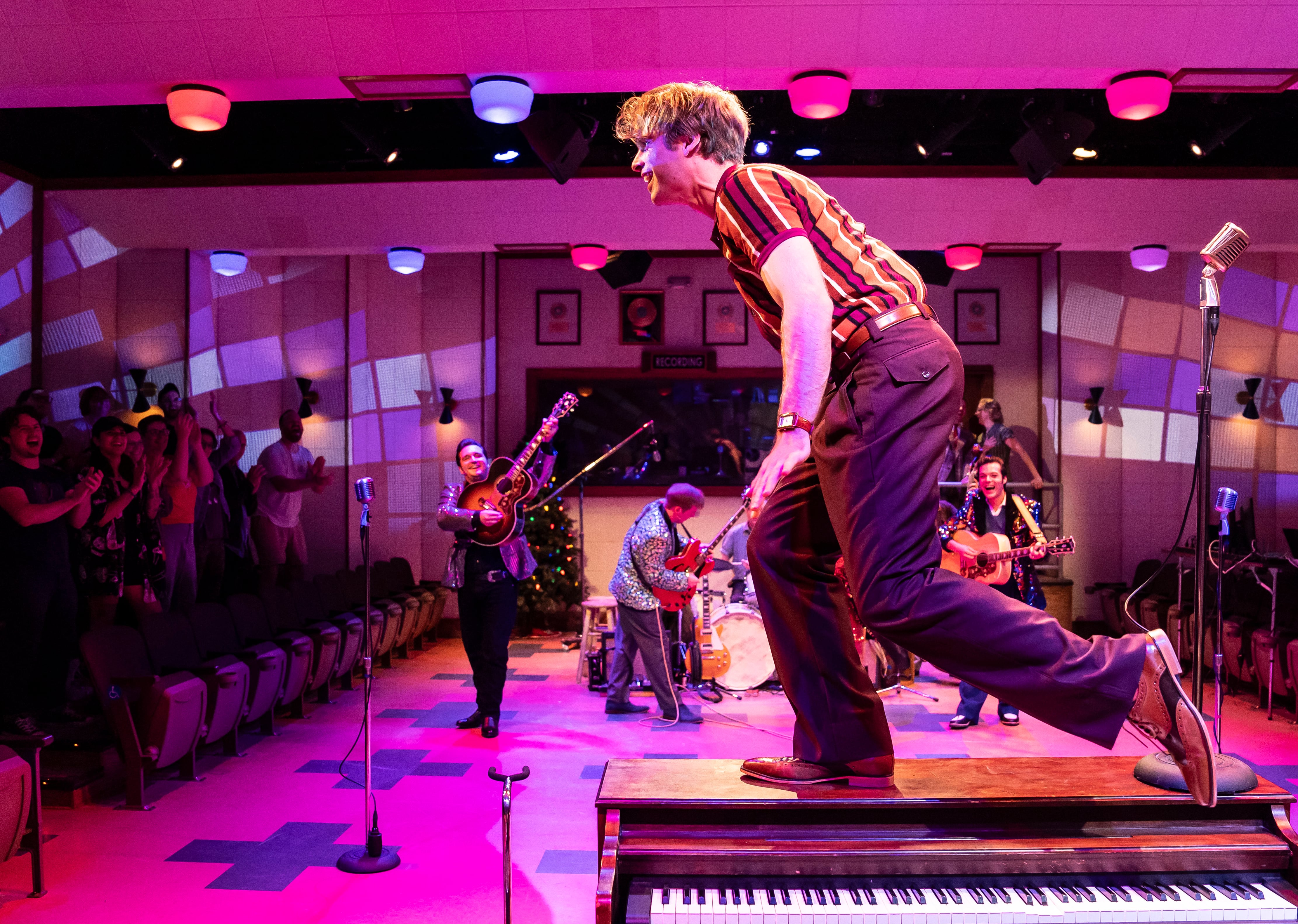 Garrett Forrestal (center) plays Jerry Lee Lewis in Million Dollar Quartet, the inaugural production at Paramount Theatre’s new Stolp Island Theatre, 5 E. Downer Place, Suite G, in downtown Aurora. Performances have already been extended through December 29, 2024 due to popular demand. Also pictured (behind, from left): Bill Scott Sheets as Johnny Cash, Christopher Wren as Carl Perkins and Alex Swindle as Elvis Presley. Tickets: paramountaurora.com or (630) 896-6666. Credit: Liz Lauren