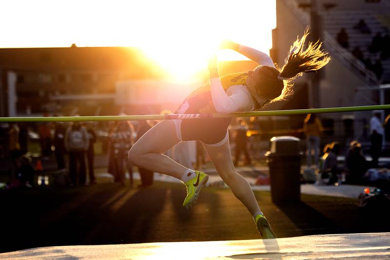 Sterling’s Abby Ryan makes her final jump in the high jump Thursday, April 25, 2024 at the Sterling High School Night Relays.