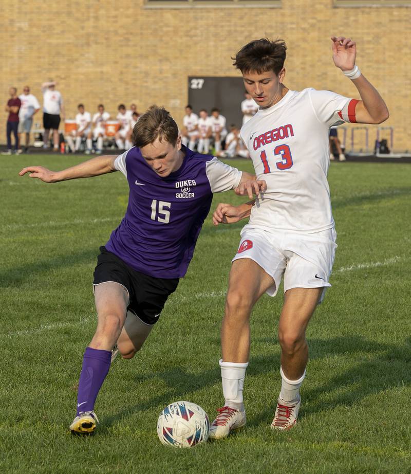 Dixon’s Logan Greet and Oregon’s Ivan Hernandez play the ball Wednesday, Sept. 11, 2024, at EC Bowers field in Dixon.