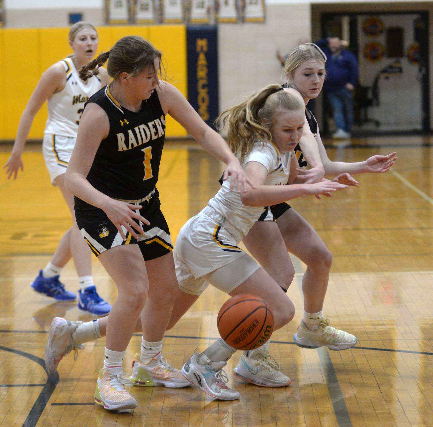 Polo's Camrynn Jones (right) and Ashton-Franklin Center's Alexis Schwarz (left) battle for a loose ball during a Wednesday, Jan. 3, 2023 game at Polo High School.