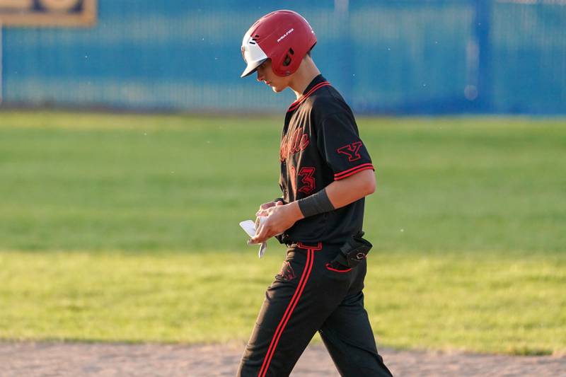 Yorkville's Jackson Roberts (13) walks off the field after a season ending loss to Neuqua Valley at the conclusion of a Class 4A Neuqua Valley Regional semifinal baseball game at Neuqua Valley High School in Naperville on Thursday, May 23, 2024.