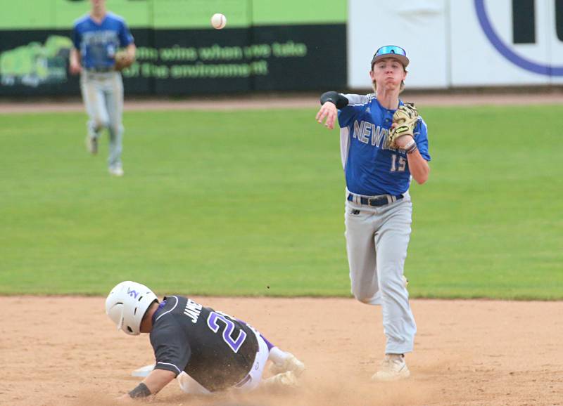 Newman's Liam Nicklaus throws to first base after forcing out Wilmington's Shawn James at second base during the Class 2A third place game on Saturday, June 1, 2024 at Dozer Park in Peoria.