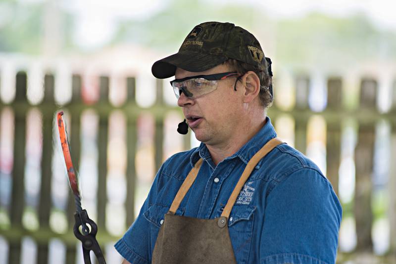 John Deere Historic Site blacksmith Dave Sheely teaches fourth-graders about blacksmithing and why it was important to the shaping of Dixon and surrounding communities.