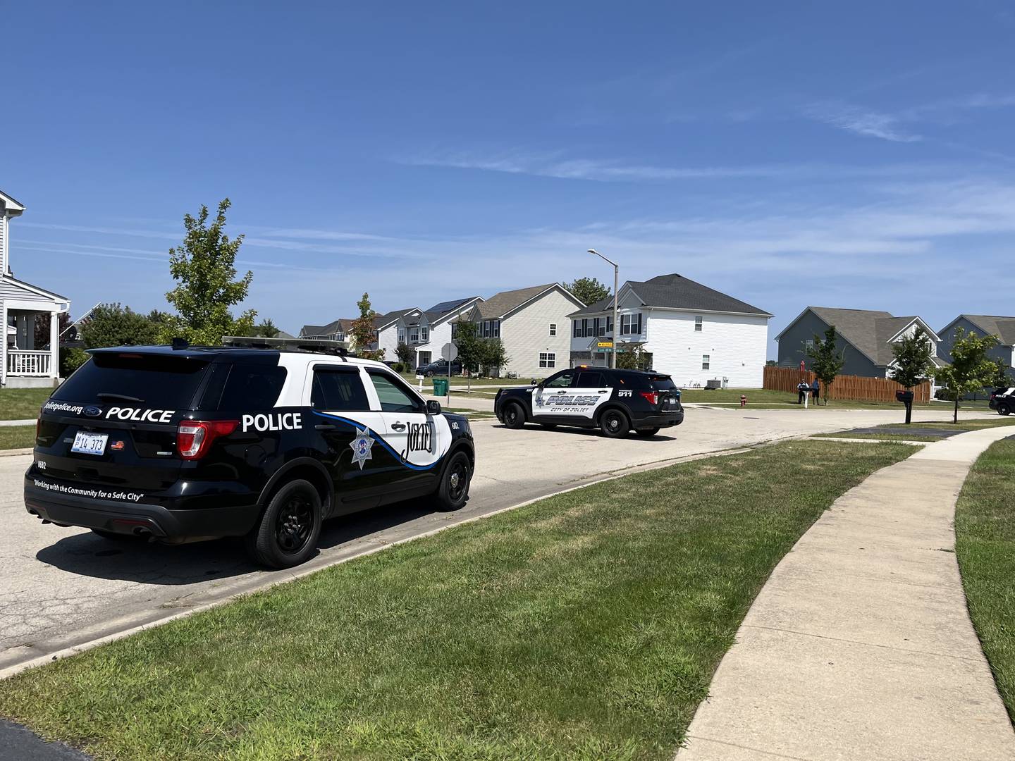 Joliet police squad vehicles parked on Thursday, Aug. 22, 2024, near the corner of Silver Lake Street and Silver Creek Drive.