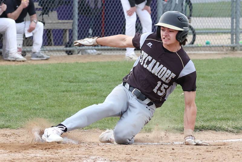 Sycamore's Will Klumpp scores a run on wild pitch during their game against Rochelle Wednesday, April 10, 2024, at Rochelle High School.