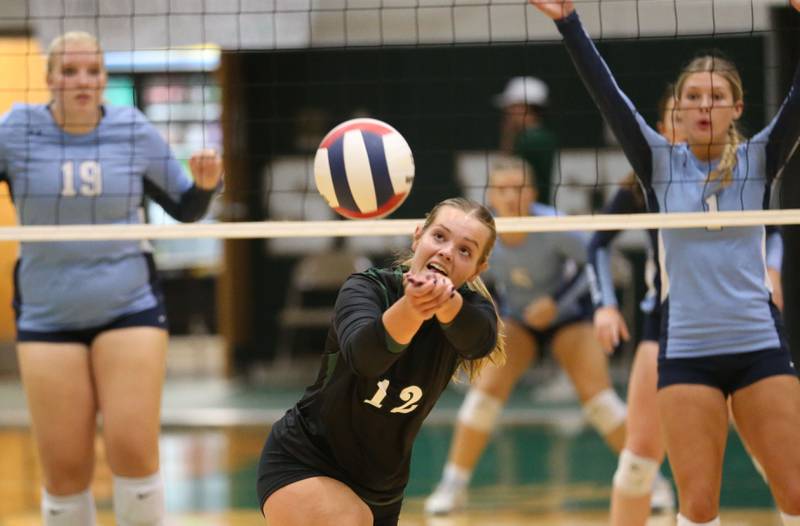 St. Bede's Sadie Koehler saves the ball while Bureau Valley's Emma Stull and teammate Kinley Canady get set on Monday, Sept. 9, 2024 at St. Bede Academy.