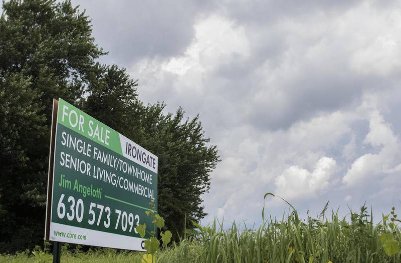 A sign for the sale of the land that was formerly the proposed Irongate subdivision sits Thursday along Dresser Road in DeKalb.