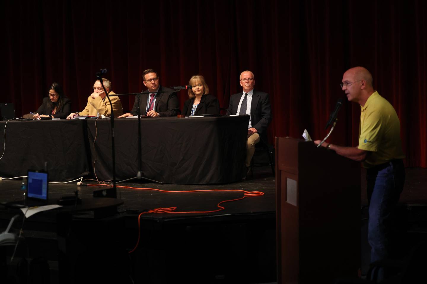 Joliet resident Damon Zdunichat, right, voices his concerns at a public hearing on the planned sale of Ascension Saint Joseph – Joliet hospital hosted by the Health Facilities & Services Review Board on Friday, Sept. 6, 2024 in Joliet