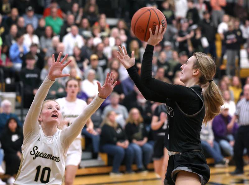 Kaneland's Alexis Schueler shoots over Sycamore's Lexi Carlsen during their Class 3A sectional semifinal Tuesday, Feb. 20, 2024, at Sycamore High School.